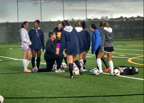 Greeley West girls soccer coach Mike Lordemann discusses a plan for practice at DIstrict 6 Field on Wednesday night.  Lordemann announced his retirement from the girls program at a meeting with players and coaches Monday night. 