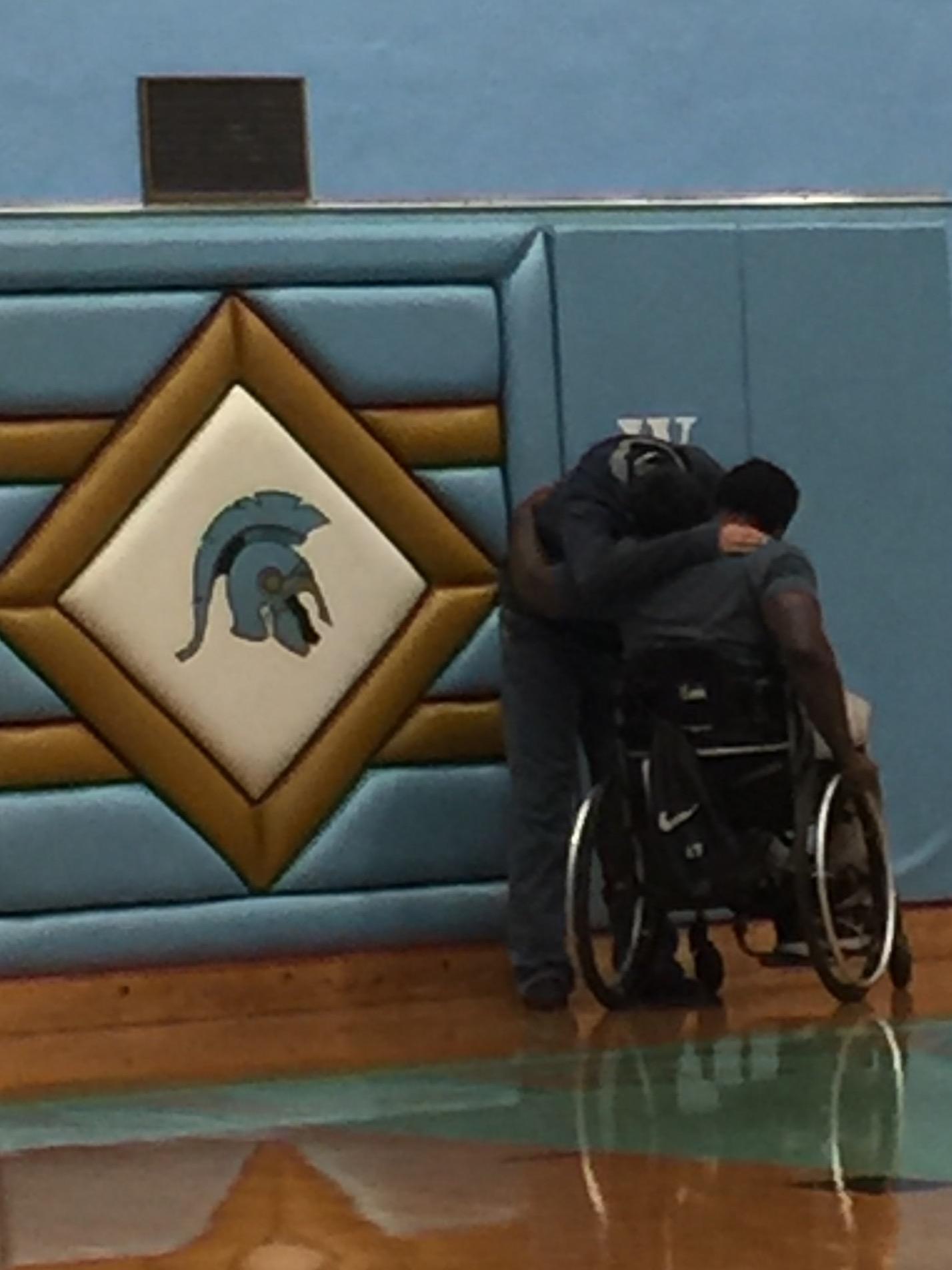 Guest speaker Timothy Alexander consoles a student who was brought to tears by his presentation on Thursday at Greeley West High School