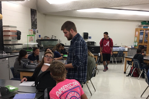 Mr. Taylor Plantt teaches his forensic science class.  