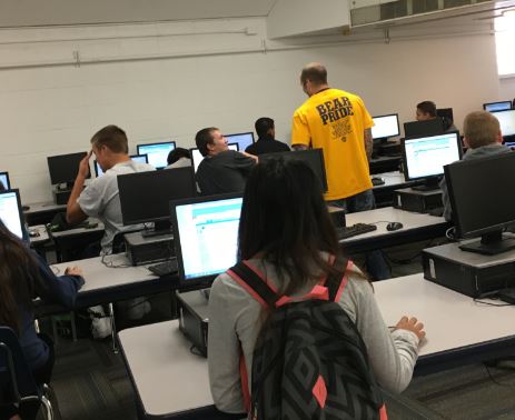 Mr. Mitch Johnson works with a CLC class in the computer lab last week, teaching them Naviance.  