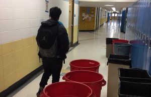 A Greeley West student walks to class during third period down the 600 hallway two years ago, dodging trash cans as he goes.  This wont be a problem for future Spartans after the community passed Bond Issue 4C on Tuesday night.