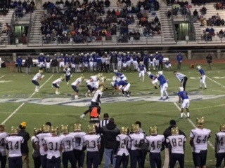 The football team lines up for a fourth down play.