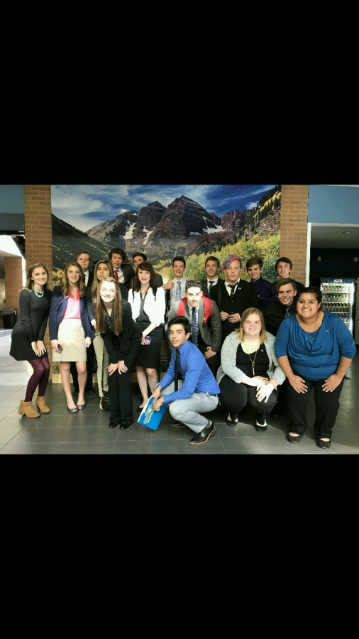 DECA students pose for a picture after competing and qualifying five students for State.  