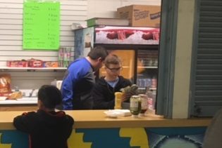 Taylor Rivera helps a customer at the concession stand last week.  The concession stand will be replaced later this year with a coffee shop.  