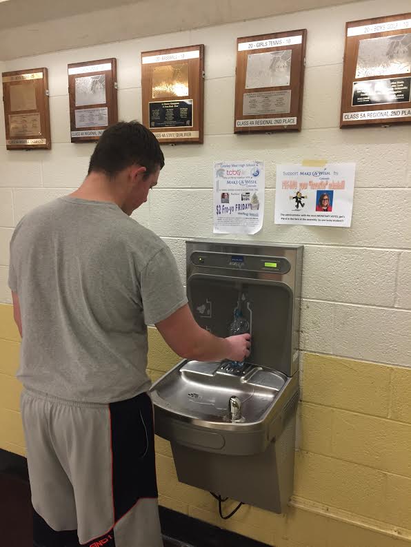 Junior Damen Turnquist fills up his water bottle last week at Greeley Wests new water station.