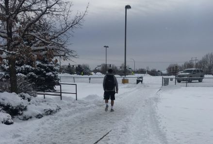 A Greeley West student walks to class through the snow on Thursday, January 5.