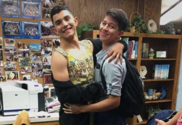 Seniors Oscar Flores and Kris Ramos pose for a picture in womens clothing for West-Central week.