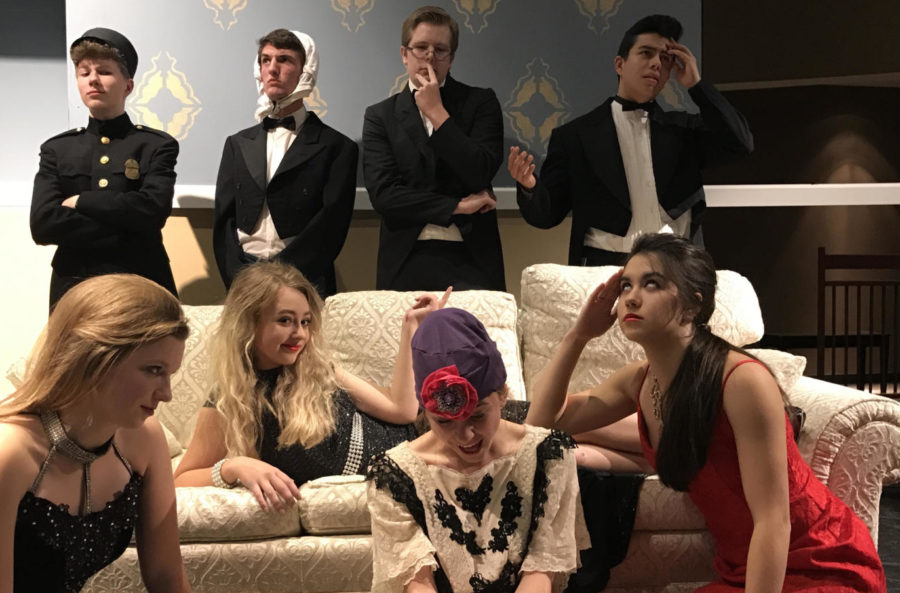 The cast of Rumors poses for a photo during a dress rehearsal.