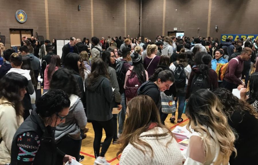 Students from around Greeley cram into the aux gym for a college fair on Monday.