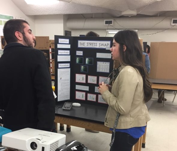 Senior Katie Gorsline presents her science fair project called Stress Swap on Thursday.