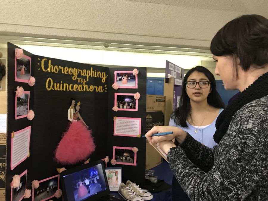MYP student Maria Villagomez shares her project with her evaluator Ms. Kory Zulauf.