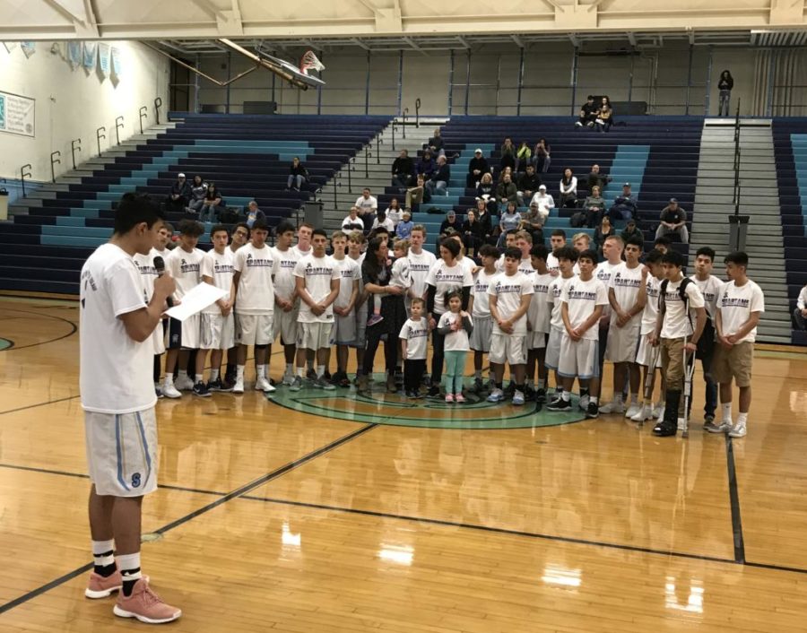 Senior basketball player Oscar Flores reads a statement explaining the need for Purple Nights supporting the Zulauf family.