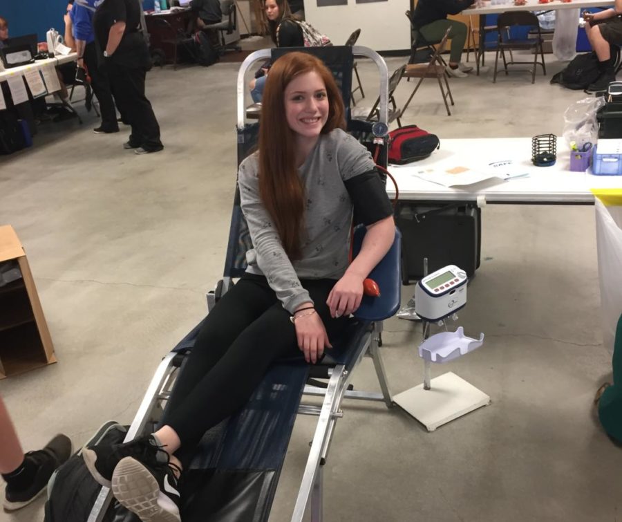 Lara Austin sits after donating blood on Monday.