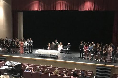 The Greeley West National Honor Society inducts new members in a ceremony on Monday night.