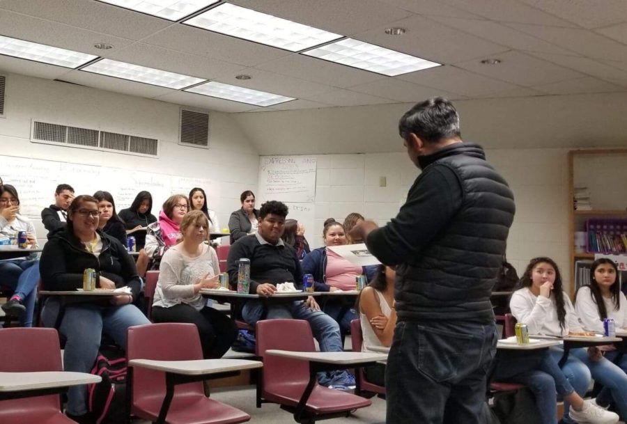 Mexican artist Mizrain Cardenas talks to a group of Greeley West students in the presentation room about following their muse.  