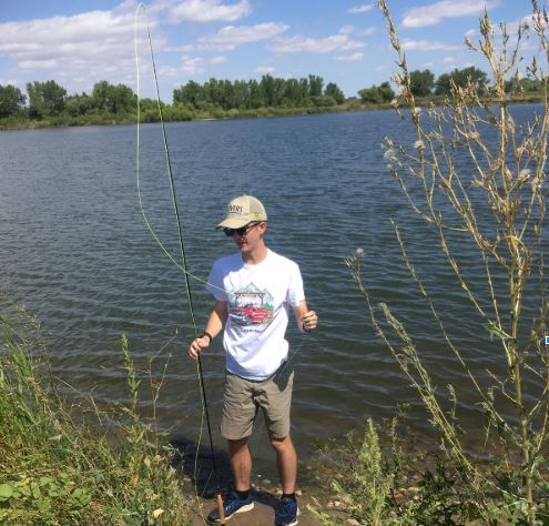 Junior Zach Headley prepares to cast his fly into the Poudre River on Monday.  