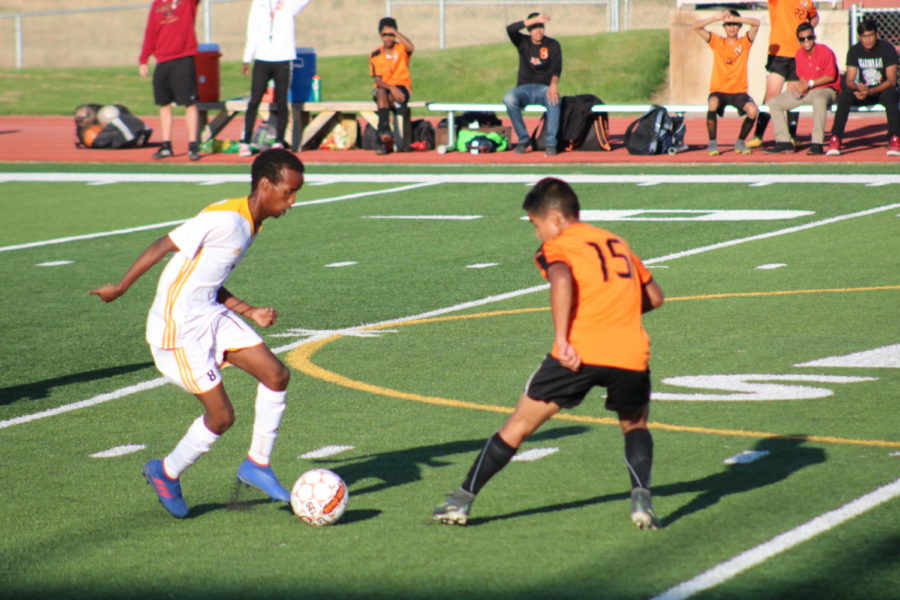 Greeley West senior Salman Hassan dribbles the ball at midfield during Tuesday nights soccer game at District 6 Stadium.  Central beat the Spartans, 2-0. 