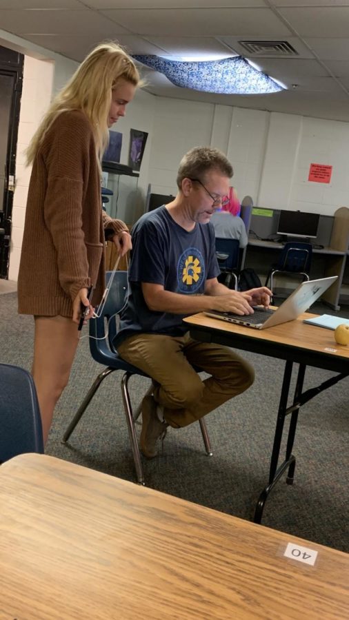 Mr. Colin Shaha helps senior Sydney Mathiot in the credit recovery lab earlier this week.   