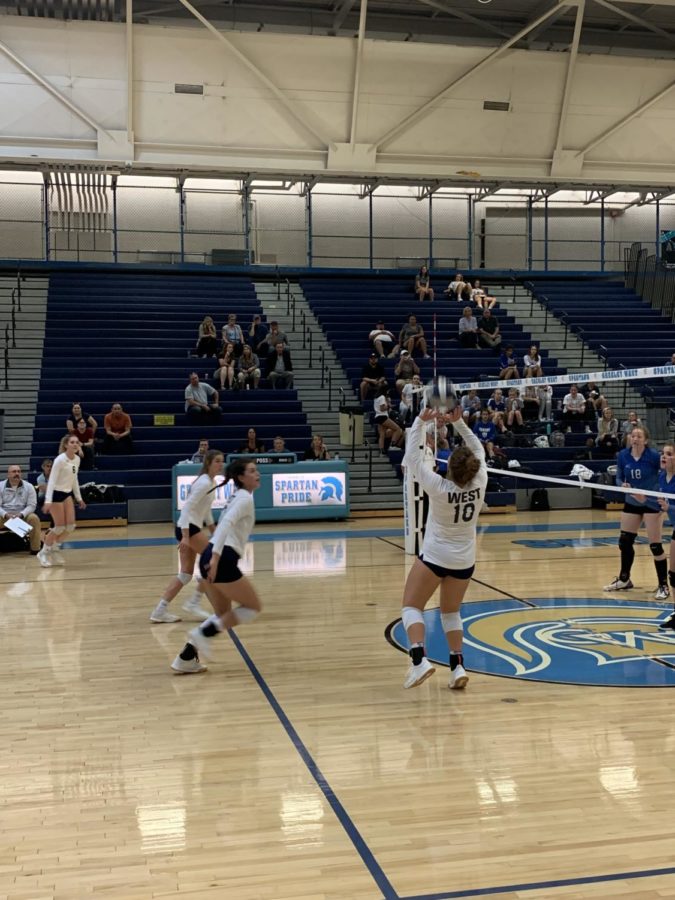 Senior Grace Whyrick sets the ball to senior Mia Pena in the Spartans 3-1 victory over Poudre on Thursday night.  