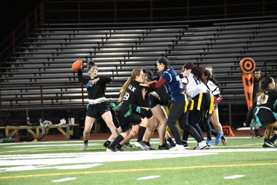 Greeley West powderpuff players from 2017 mix it up during their game.