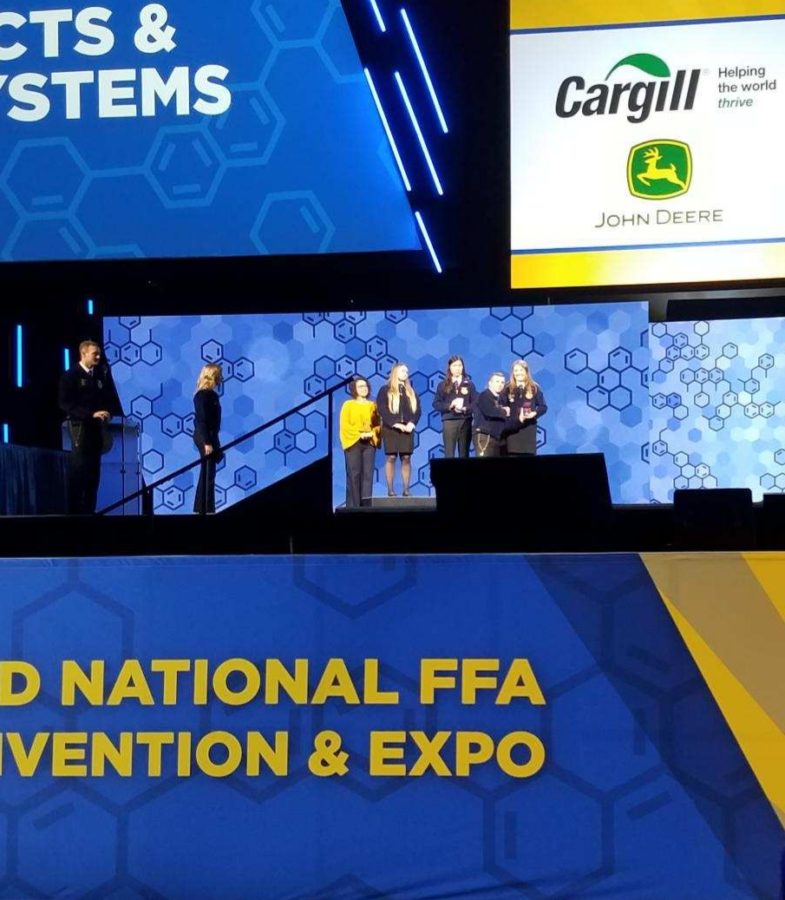 Kathryn Broderius is presented her reward in Lucas Oil Stadium in Indianapolis, Indiana at the FFA National Convention.  She may look like dot in this picture, but the venue holds 75,000 people and this was as close as we could get. 
