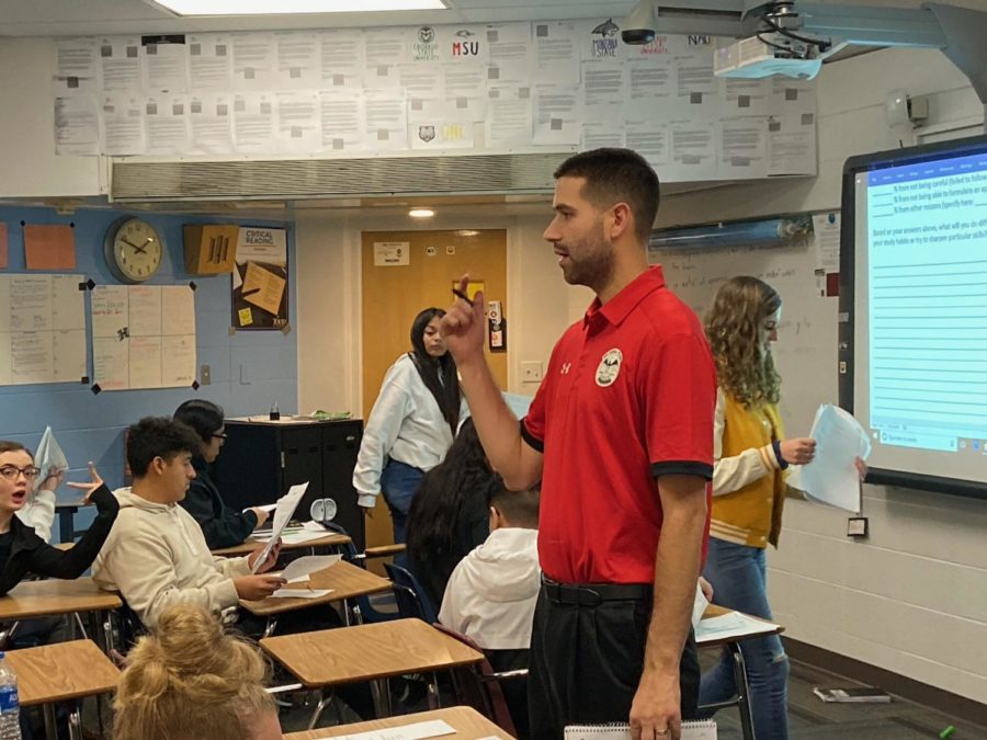 Mr. Stephen Paulson teaches his AP Human Geography class on Thursday behind his bushy beard.  Paulson started the No Shave November competition on November 1 and now bares no resemblance to the clean-shaven, handsome man he used to be. 