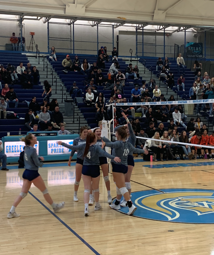 The Greeley West volleyball team celebrates a point against Greeley Central earlier this season.