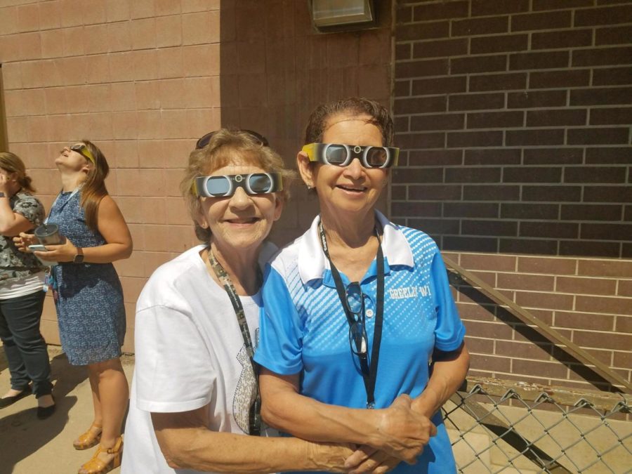 Greeley West staff members Ms. Alice Weidenkeller (left) and Ms. Sophie Rogers celebrate an eclipse at Greeley West a few years back.  Greeley West paused on Monday to celebrate Weidenkellers life after she passed away unexpectedly last weekend. 