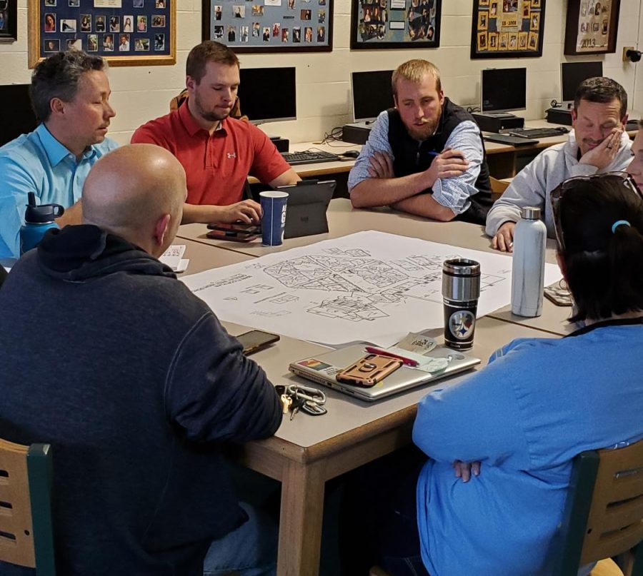 Matt Pota, left, and Austin Mouw from Hord Coplan Macht and Adolf and Peterson, respectively, meet with Greeley West faculty members about new school designs on Friday.  