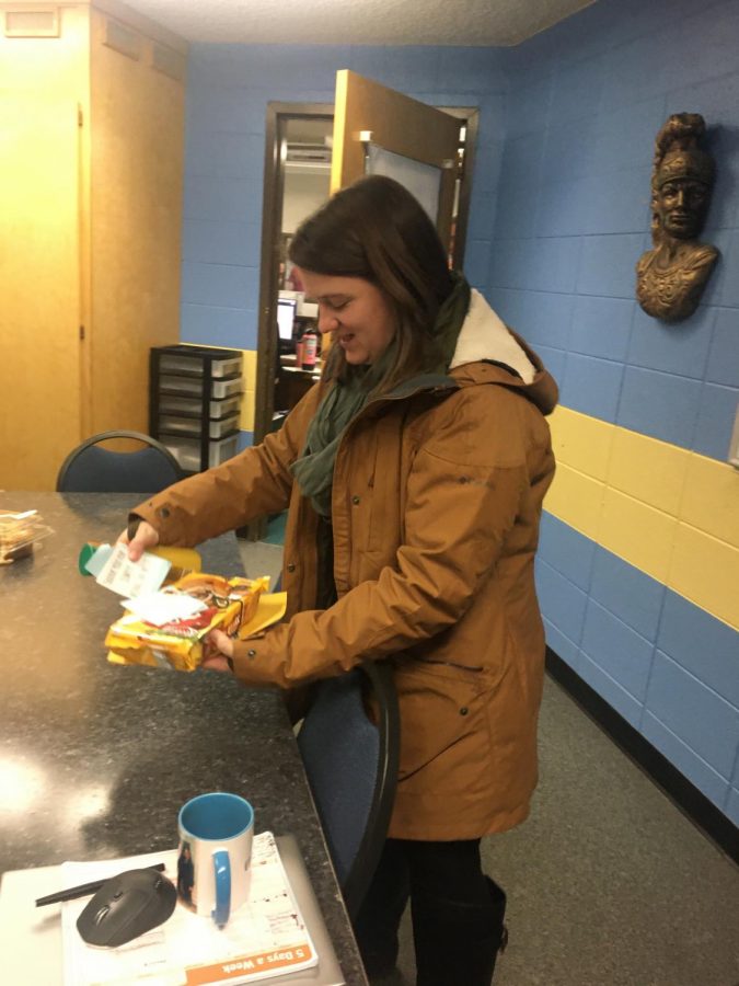 Ms. Kelly Stephens checks out a gift presented to her by the Greeley West Student Council last week for National Counselors Week.