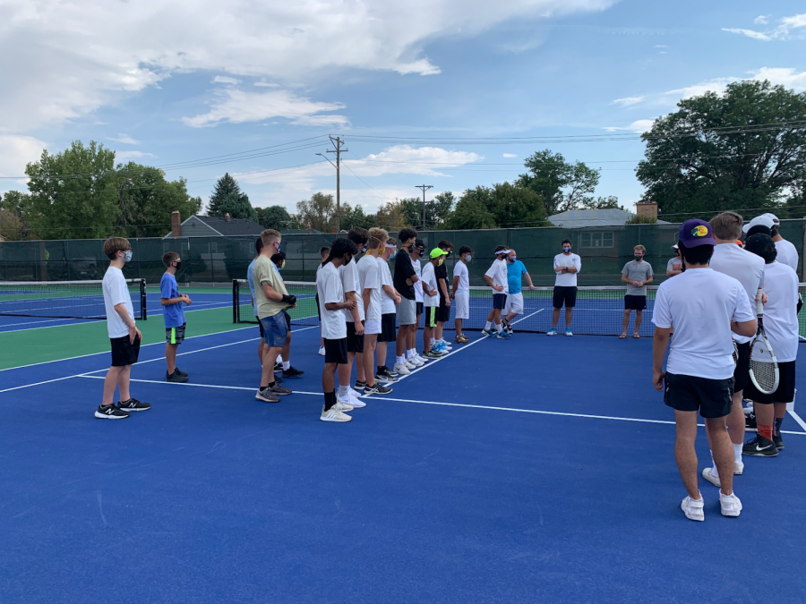 The boys tennis team lines up against cross-town rivals Greeley Central earlier this season.