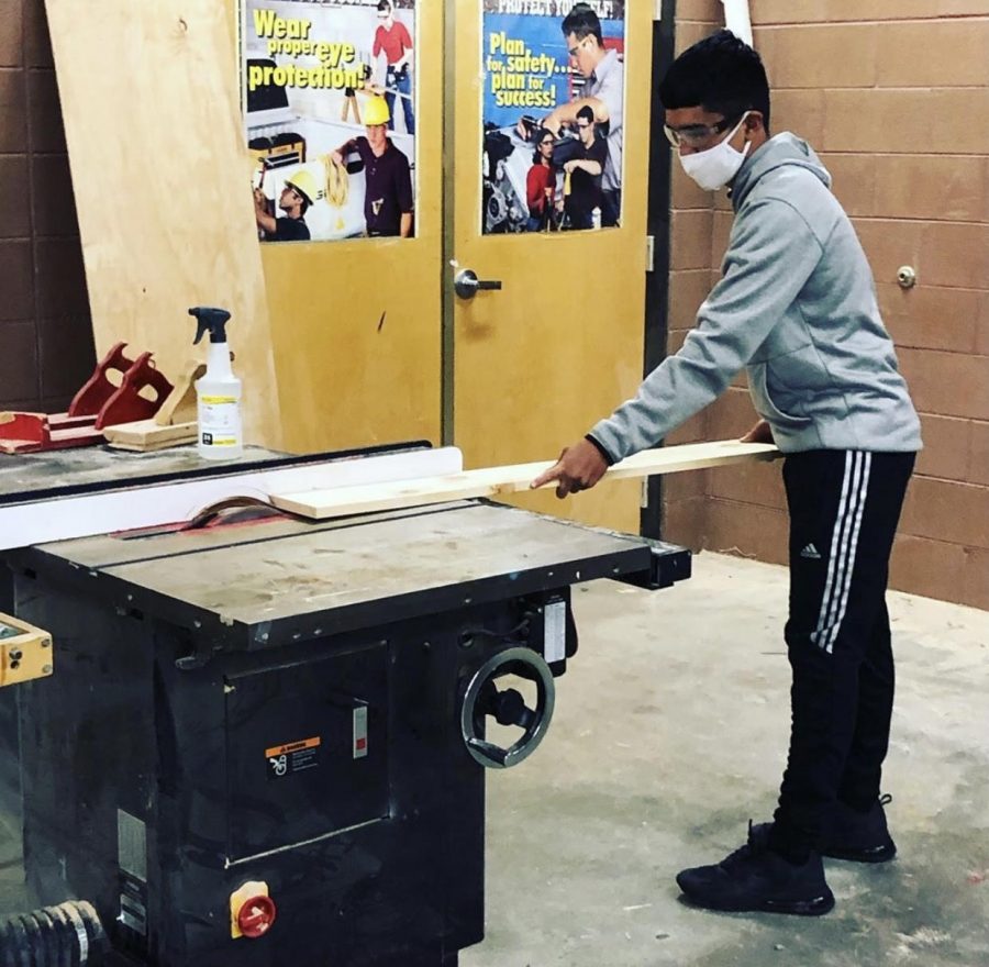 Working in the wood shop has presented challenges in this era of no hands.  But students are finding ways to make the most of their eight week quarter class. 