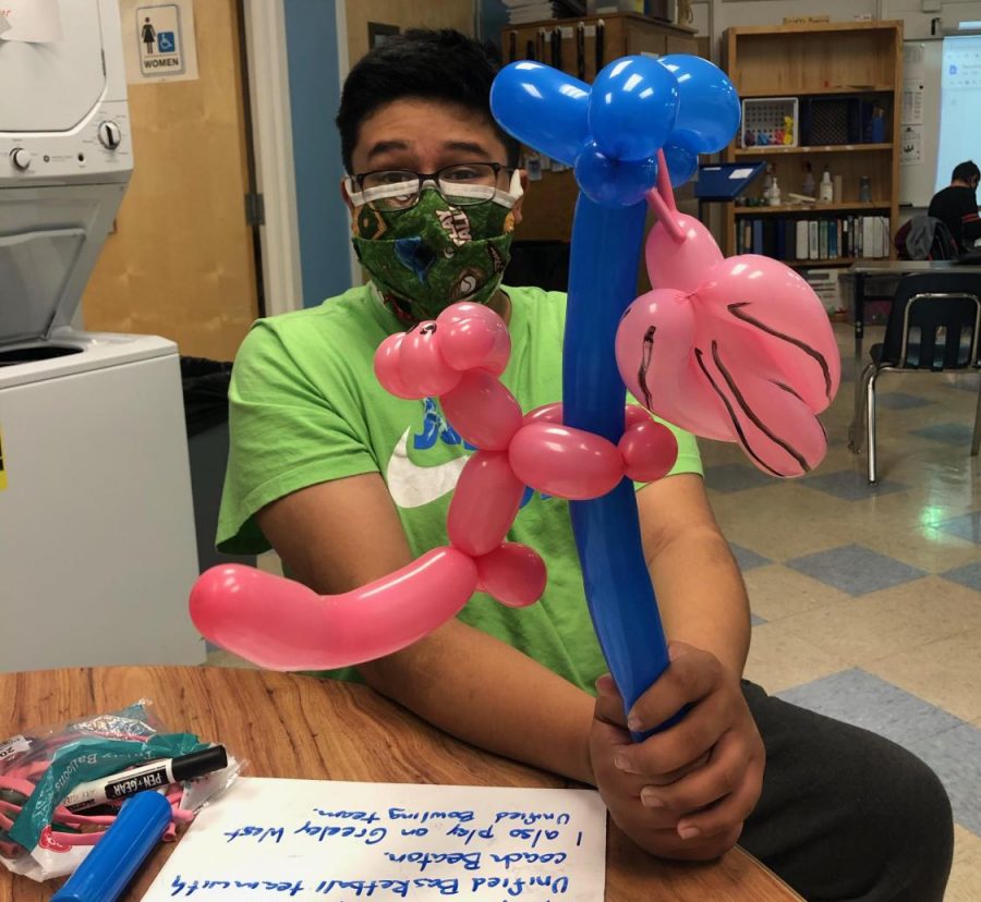 Senior Nathaniel Vigil shows off one of his latest pieces of balloon art.  Vigil picked up the hobby last Spring when coronavirus forced Americans into isolation. 
