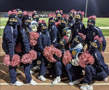 The Greeley West cheerleaders pose before  a football game in October.