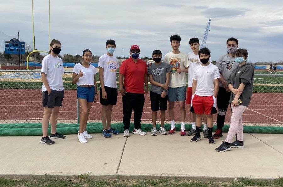 The Greeley West distance team poses for a picture with Thomas Valles.  Valles was a state-champion cross country runner who was the inspiration for the Disney movie McFarland, USA.