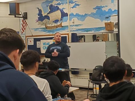 Coach John Hickey introduces himself and his philosophies to Greeley West football players in the choir room on Wednesday.  