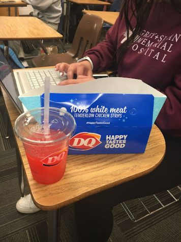 One student enjoys their Dairy Queen lunch while working on an assignment during lunch time.  A large segment of the Greeley West population eats fast food daily, rather than eat the food District 6 provides. 
