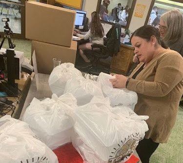 Greeley West office staff, Ms. Tammy Segura and Ms. Lin Arengard sort tacos on Tuesday to be handed out to teachers and subs who covered classes that day. 