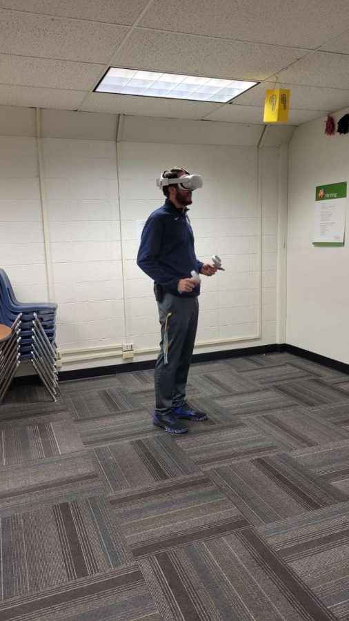 Greeley West athletic director Mr. Ryan Hilbig plays Beat Saber on the Oculus Rift in room 604A.  You, too, can enjoy the experience for just three dollars. 