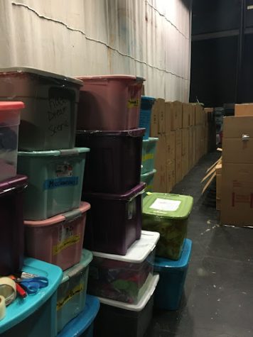 Tubs and boxes have slowly accumulated backstage in the theater.  Alumni and students get ready for one final performance on the stage on March 5. 
