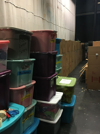 Tubs and boxes have slowly accumulated backstage in the theater. Alumni and students get ready for one final performance on the stage on March 5.
