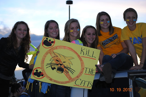 Former students (actually members of the West Word in 2012) celebrate an earlier Car Caravan in the parking lot of the old Greeley West.  Make sure to participate in this years festivities and fun.