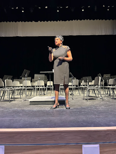 Becky Stone, portraying Josephine Baker, spoke to Greeley West students on Thursday.