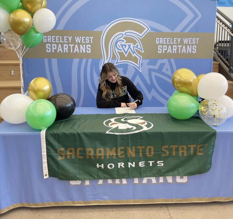 Senior+Ella+Wilcox+signs+here+letter+of+intent+to+play+soccer+at+Sacramento+State+on+Wednesday+at+Greeley+West+High+School.+