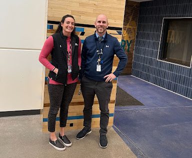 Greeley West assistant principals Ms. Amy Zulauf and Mr. Aaron Allen pose for a photo in front of the old gym floor.  Both will be building principals next year in District 6.