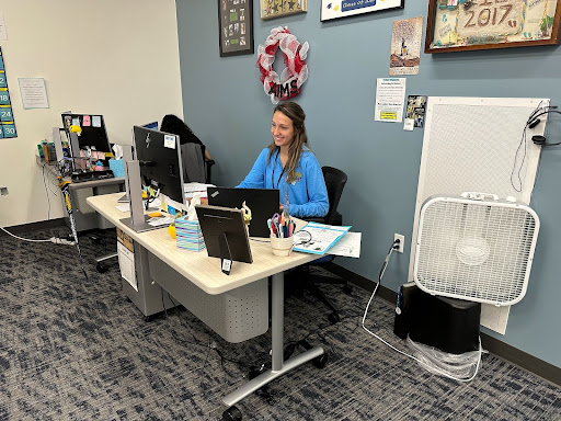 Ms. Jordan Sanchez works at her desk this week in the Futures Center  Sanchez has 15 siblings and has learned to communicate with high school kids through that experience.