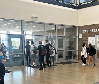 Greeley West campus monitors check IDs on the way out of the building last week at B lunch.  