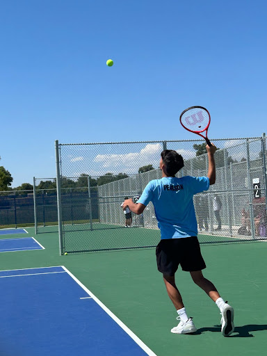 Sophomore James Pearson serves during a doubles match on Friday afternoon at Greeley West High School.
