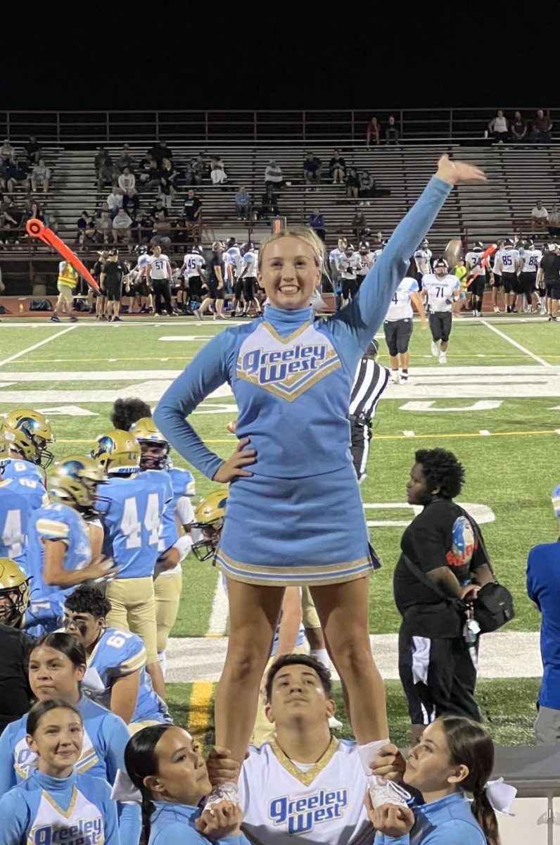 Senior+cheerleader+Tori+Wells+is+elevated+by+her+teammates.++Wells+recently+was+offered+a+cheerleading+scholarship+at+Bethel+University+in+Kansas.