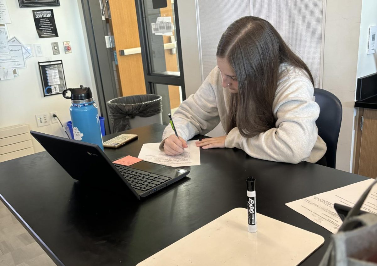 Maddy Vella fills out a questionaire during AVID class this week.  Vella balances her time so she can teach dance to youngsters in the Greeley area.
